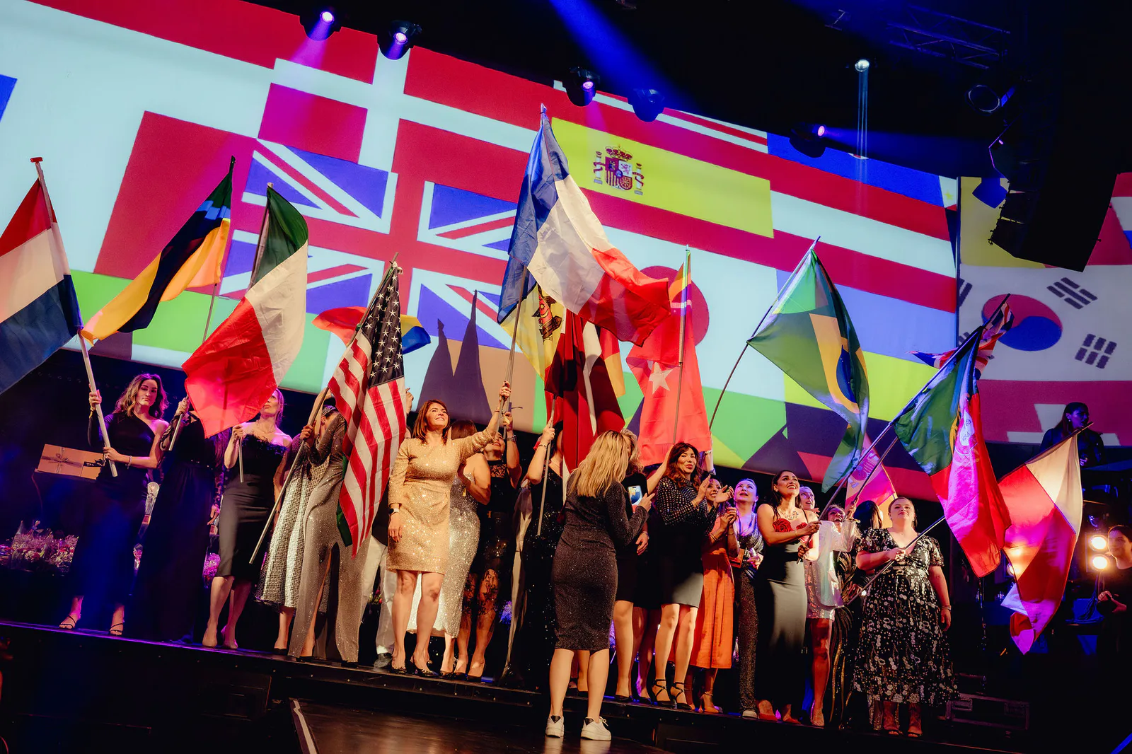 Artists carrying their national flags onto the international Browista stage